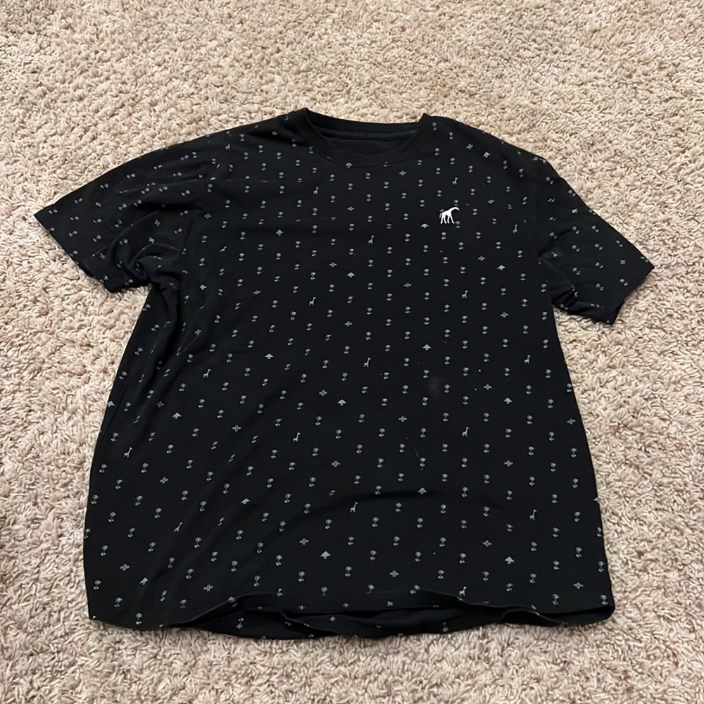 Size large black shirt with palm trees and giraffes